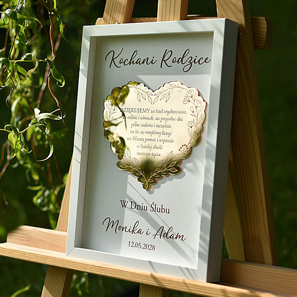 podziękowania dla rodziców na weselu, obraz ze złotym grawerowanym sercem w białej ramce